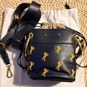 Chloé Mini Roy horse embroidered bucket bag in black leather.